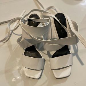 White Zara ankle strap heels.